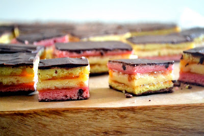 Classic Italian rainbow cookies, layered with almond cake, thin layer of apricot jam and coated with bittersweet chocolate.