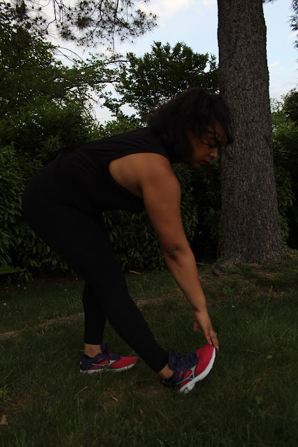 runner stretching hamstrings