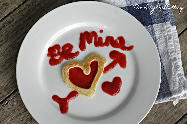 A plate of food on a table, with Valentine Pancakes
