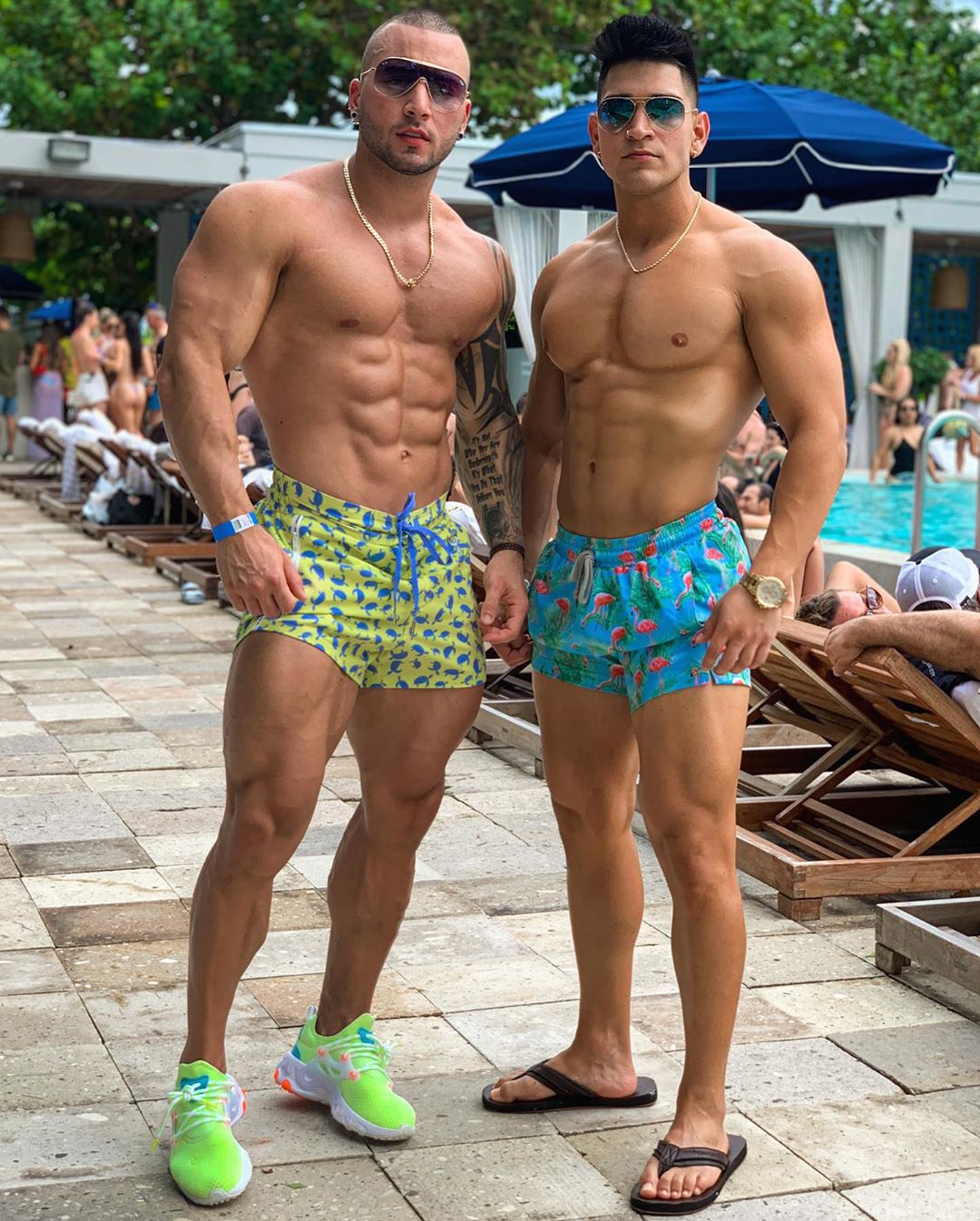 two-muscular-shirtless-hunks-pecs-abs-sunglasses-dudes-pool