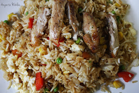Vegetable fried rice with strips of chicken candy