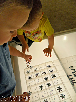 Matching and sorting alphabet snowflakes on the light table from And Next Comes L