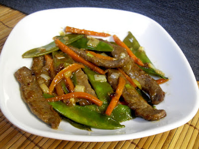 Ternera con tirabeques en salsa de ostras