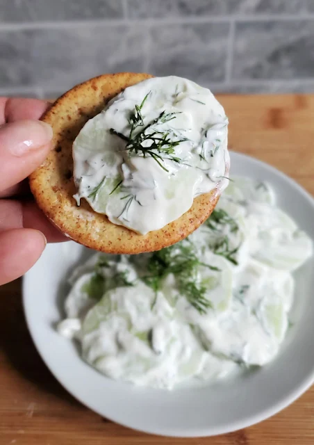 creamy dill cucumber salad on cracker