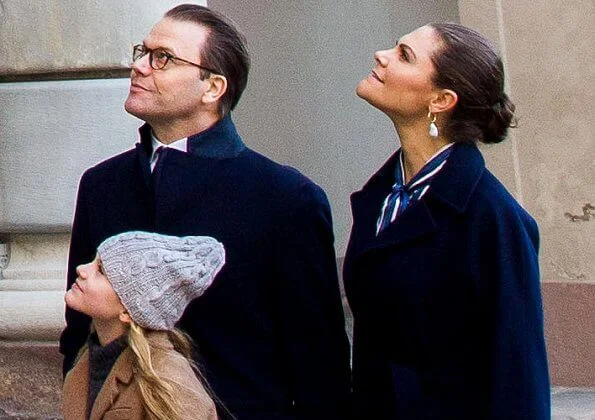 Crown Princess Victoria wore a vertical striped bow blouse form Gant, and baroque pearl earrings from Cravingfor Stockholm. Estelle wore a camel coat