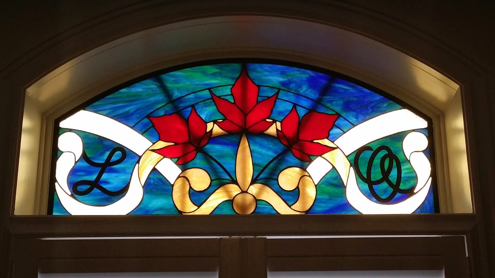 Glassworks Studio Stained Glass Transom installed this week....Canadian Flare!