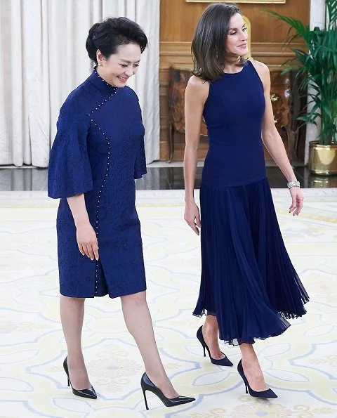 Queen Letizia wore Felipe Varela skirt and top and Nina Ricci pumps. Peng Liyuan. Queen Victoria Eugenia's Cartier diamond earrings