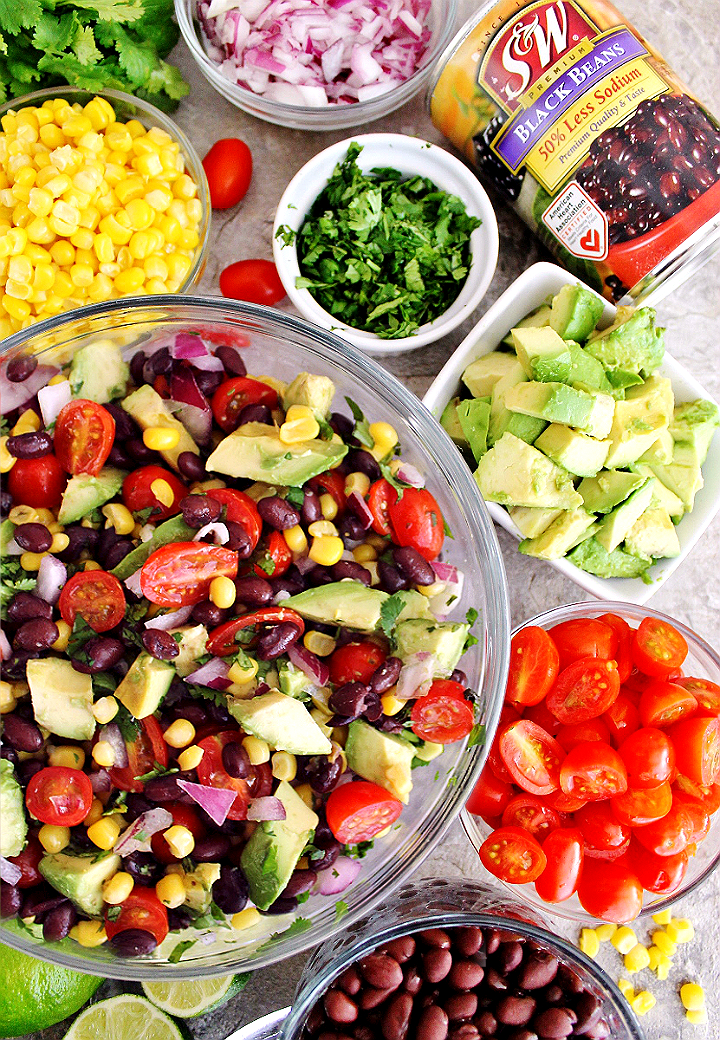 Vegan Black Bean Salad made with Red Onions, #SWBeans 50% Less Sodium Black Beans, Cherry Tomatoes, Sweet Kernel Corn, and Fresh Avocado. Discover healthier meal, and even dessert, options with #SWbeans varieties such as 50% Less Sodium and Organic! #IC #AD 