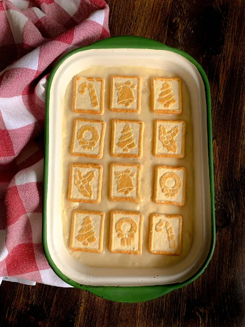 Pineapple Pudding, creamy, velvety homemade custard pudding layered between Pepperidge Farm Butter Cookies, classic southern.  Simply scrumptious, the Christmas Chessmen add a charming touch to the dessert during the holidays.
