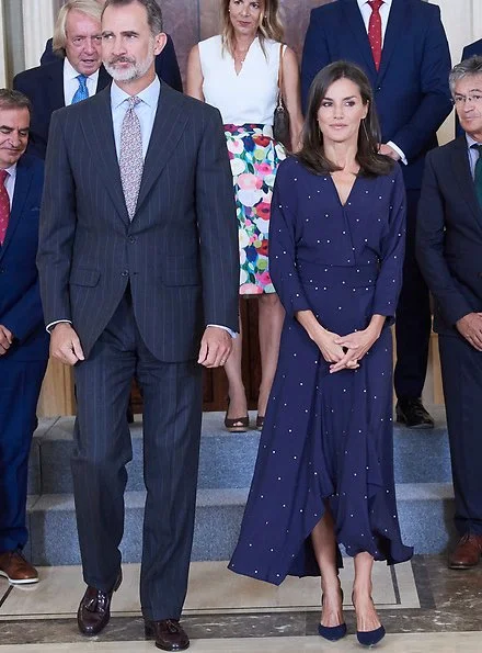 Queen Letizia wore a new asymmetric midi dress by Maje. We saw the same dress on Argentina's First Lady Juliana Awada