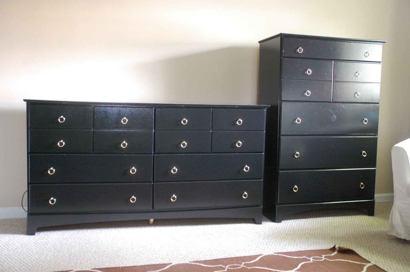 Lisa Moves black dressers with gold ring pulls