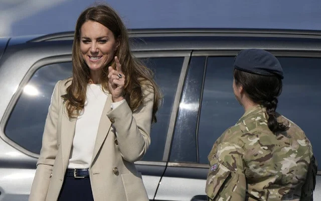 Kate Middleton wore a new double-breasted blazer by Reiss Larsson, and high waisted sport luxe trousers by Jigsaw