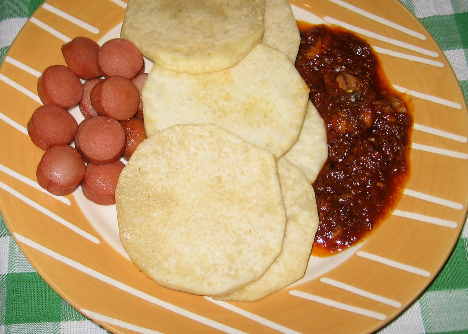 Nigerian Fish tomato Stew with fried yam, sausages