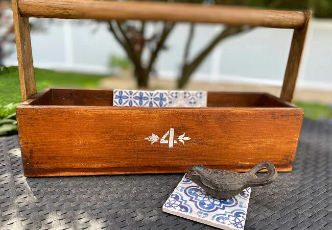 wooden crate with number 4 and coasters inside