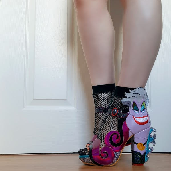 wearing Disney Ursula sandals with fishnet socks