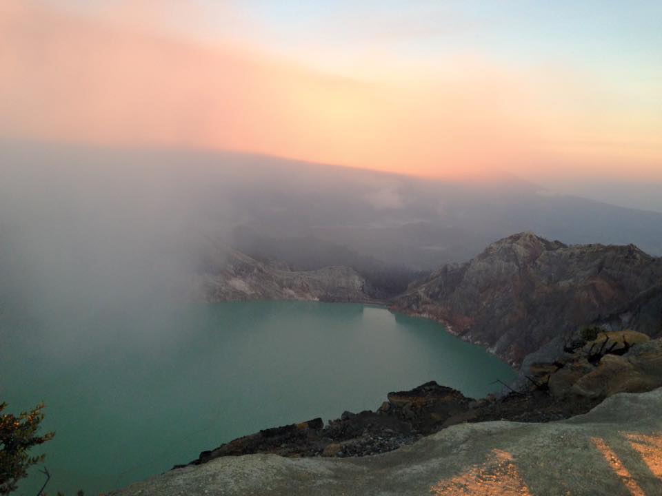 sunrise at kawah ijen indonesia, the volcano whith a 1km wide blue lake which is acid because of the sulfur, sunrise java indonesia