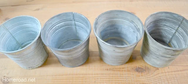 Row of 4 pails with different patinas