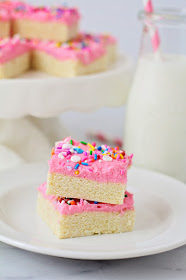 These delicious frosted sugar cookie bars have all the taste of sugar cookies, but without the rolling and cutting!