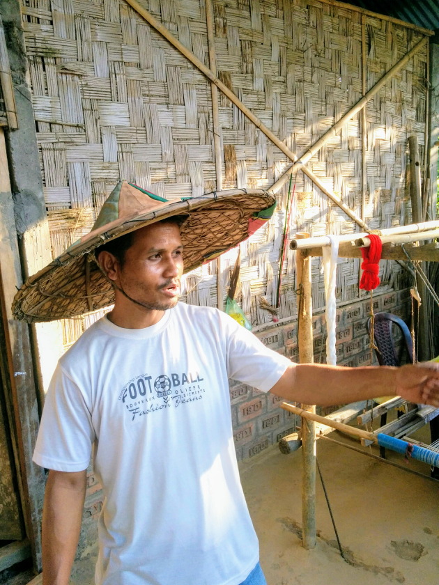 Mishing Tribe man and his traditional rain hat called Zaapi