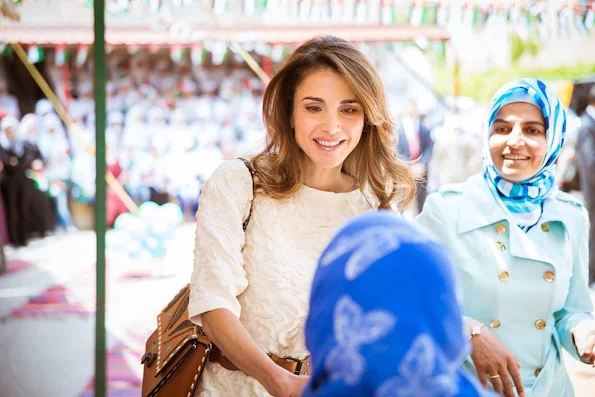 Queen Rania of Jordan visited the Safout Secondary School for Girls in connection with 70th anniversary of Jordan’s Independence Day and the 100th anniversary of the Great Arab Revolt. Queen Rania Style, Fendi dress, a bag