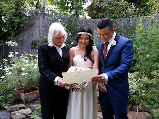 Mino and Belle receive their certificate of marriage