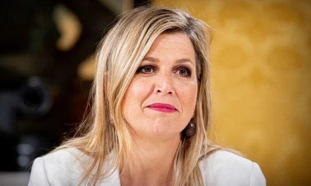 Queen Maxima wore a new white plain blazer suit from Massimo Dutti, and brown silk blouse
