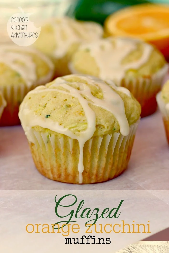 Glazed Orange Zucchini Muffins by Renee's Kitchen Adventures on a board with text overlay