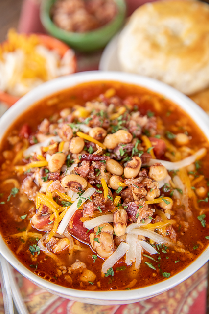 Black-Eyed Pea Soup - a New Year's tradition! Super easy to make and tastes GREAT! Ready to eat in about 20 minutes. Bacon, canned black-eyed peas, onion, garlic, chili powder, diced tomatoes & green chiles, chicken broth, salt, and pepper. Serve with some biscuits or cornbread. Comfort food at its best! #soup #stew #blackeyedpeas #chili bowl of soup