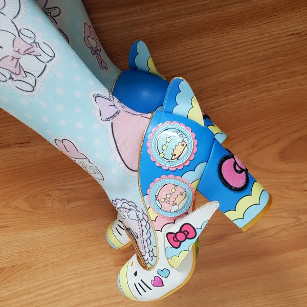 close up of Sanrio Irregular Choice shoes in blue with aeroplane details