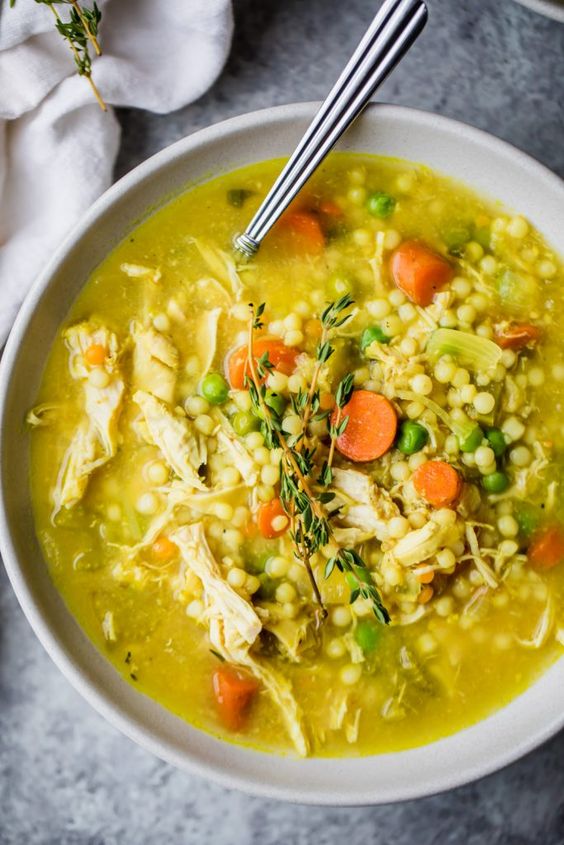 The BEST chicken soup you'll ever eat is the best homemade nourishing healthy soup when you're feeling under the weather. Packed with anti-inflammatory ingredients like ginger, turmeric, garlic. BEST SOUP EVER!