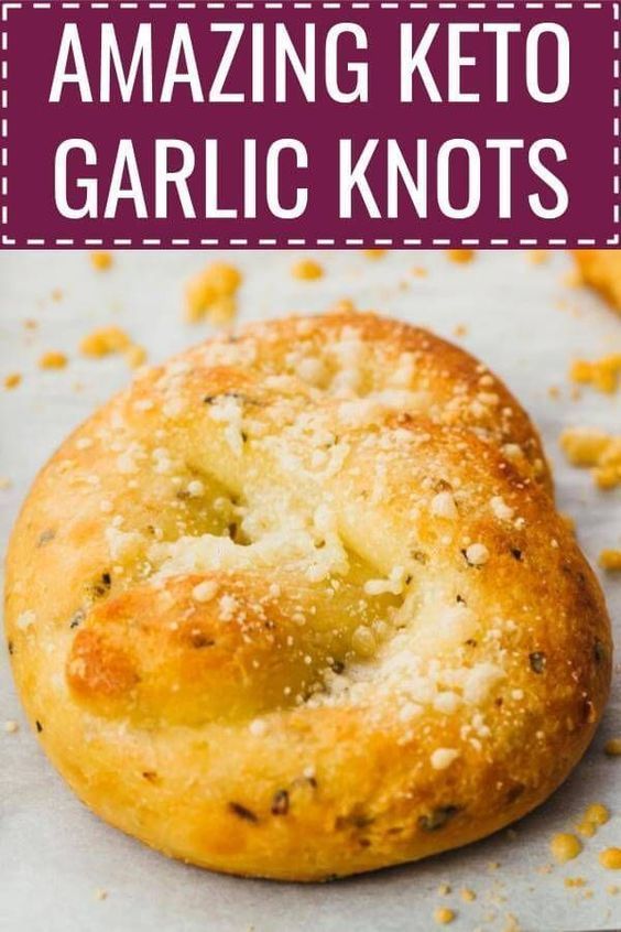 These are AMAZING keto garlic knots! Better than bread sticks. Cheesy, soft, and I can't believe it's keto because it feels like I'm cheating. The recipe is easy and quick, uses a standard fathead dough, and great for anyone on a low carb, gluten free, and grain free diet. Click the pin to find the recipe, nutrition facts, cooking tips, & step-by-step photos. #healthy #healthyrecipes #lowcarb #keto #ketorecipes #glutenfree