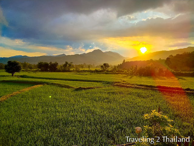 Sunrise over rice field & mountains in Pua, North Thailand Traveling in North Thailand