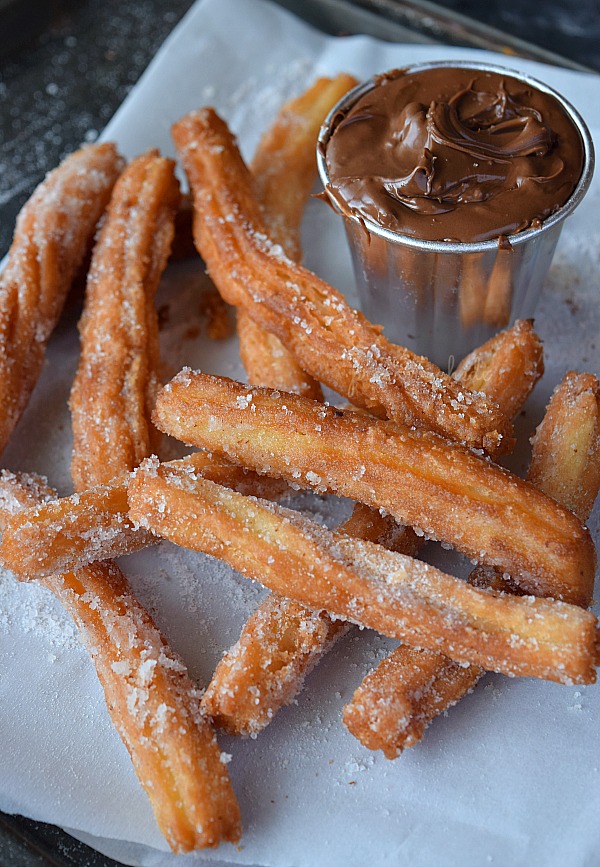 A tray with white paper served with Churros Recipe(Easy Homemade Cinnamon Sugar Churros) 