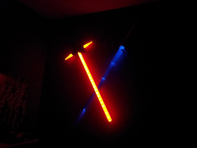 Crossed lightsabers as bedroom lighting.