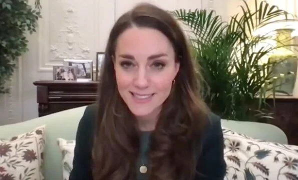 Kate Middleton wore a green wool suit blazer and sweater from Massimo Dutti, and personalized gold midnight moon necklace from Daniella Draper
