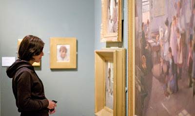 Girl viewing the artworks at the Penzance gallery 