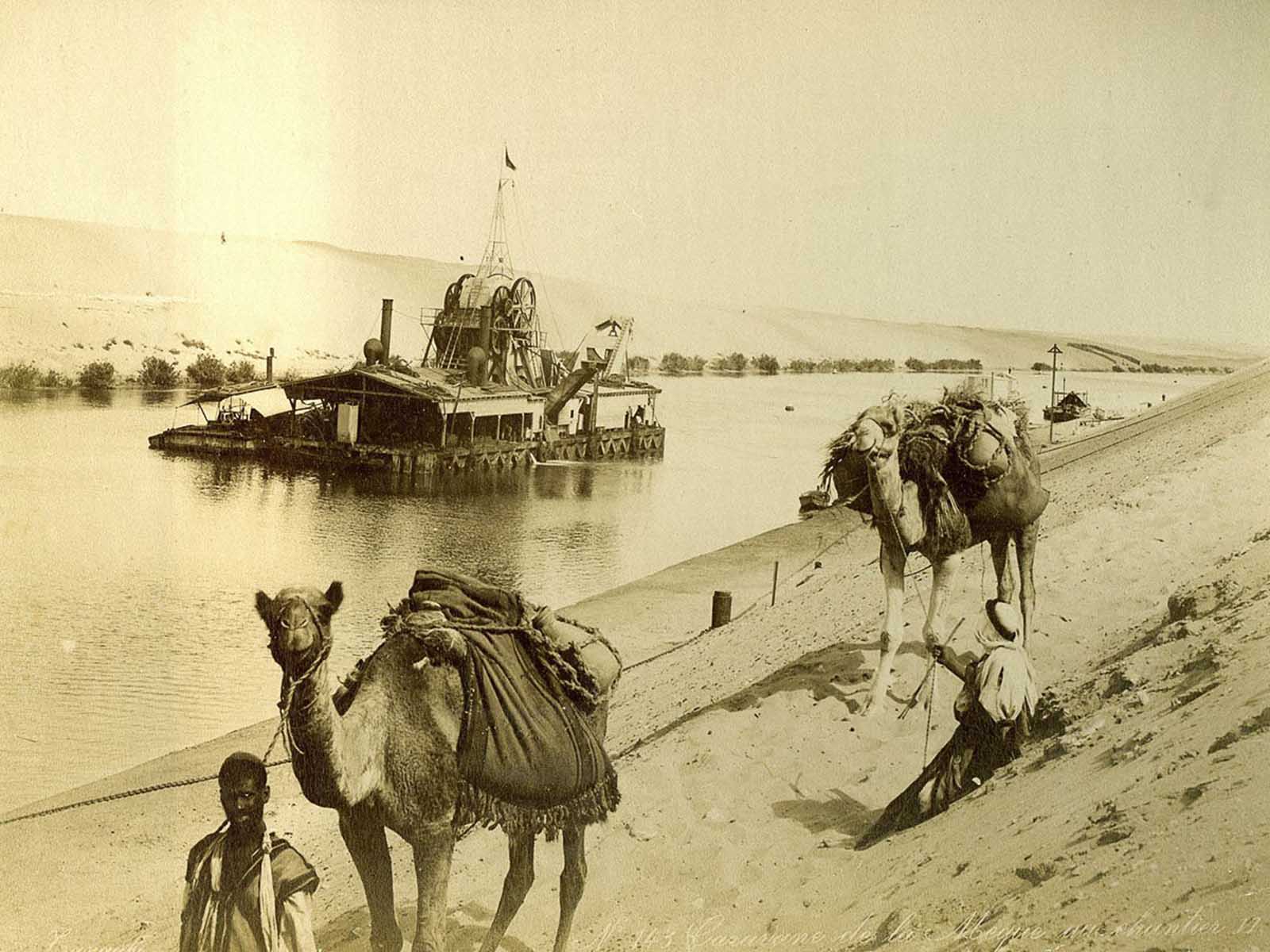 Caravan passing a dredging barge.