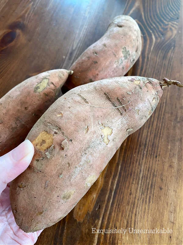 Three yams on a table