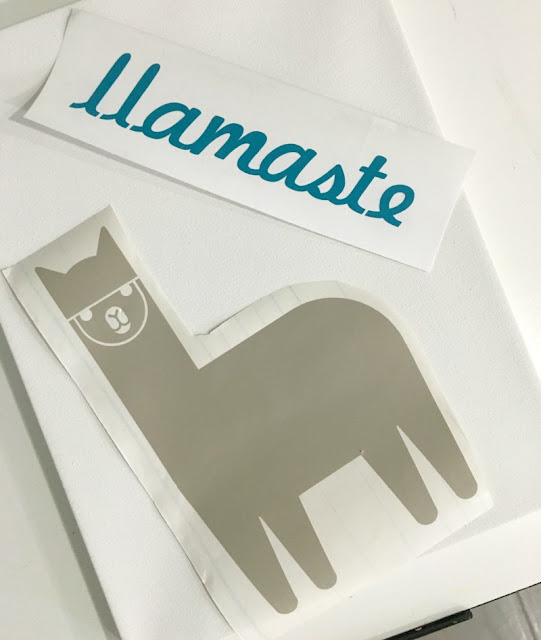 Add a touch of whimsy to a nursery with DIY painted llama pom pom wall art made with vinyl and Cricut.