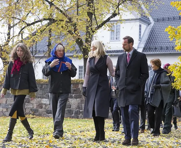 Crown Princess Mette Marit wore Valentino Cape, Prada wool sweater, Prada Boots, diamond earrings