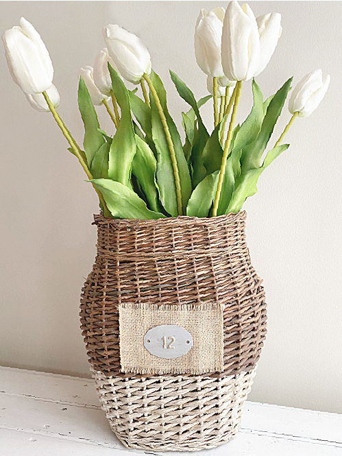 basket of white long stemmed tulips