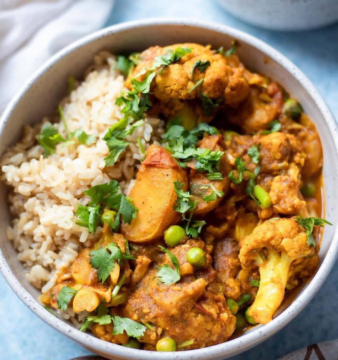 Cauliflower potatoes and peas curry