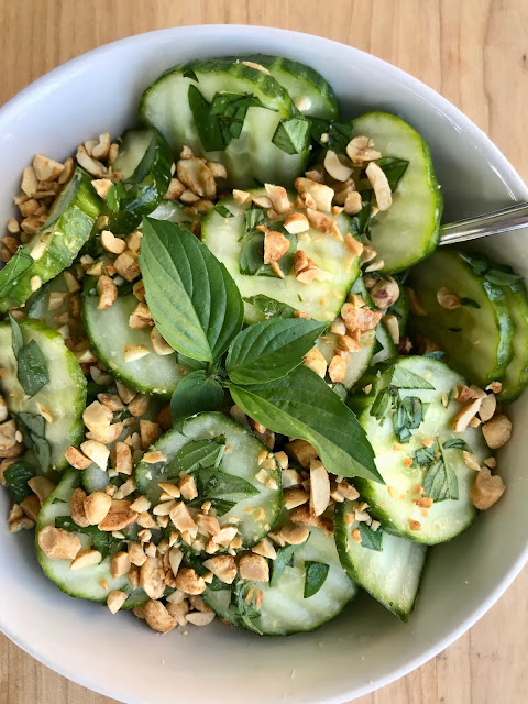 A refreshing summer salad fill of crispy cucumbers, fresh Thai basil, and a simple rice vinegar dressing, and topped with crunchy roasted peanuts.