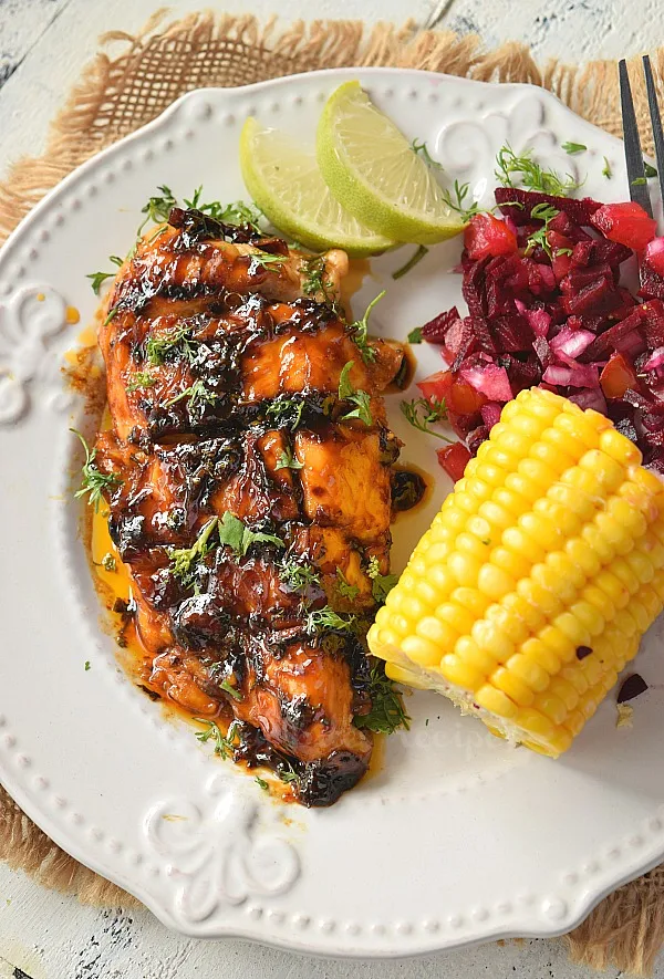 best cilantro lime grilled chicken served on a plate with beetroot salsa and corn on the cob