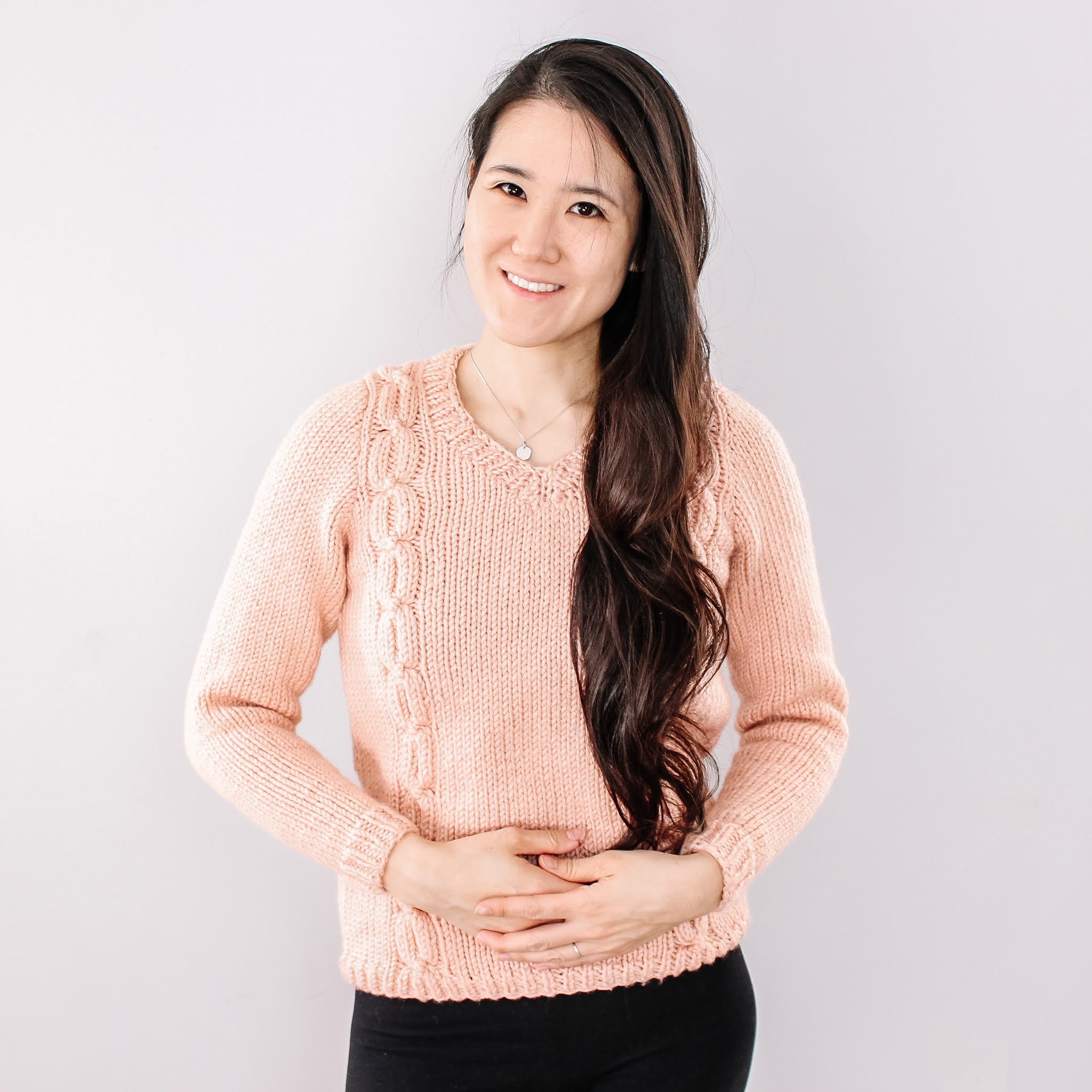 Modesty by Laura designer wearing a knit Briar Rose Pullover.
