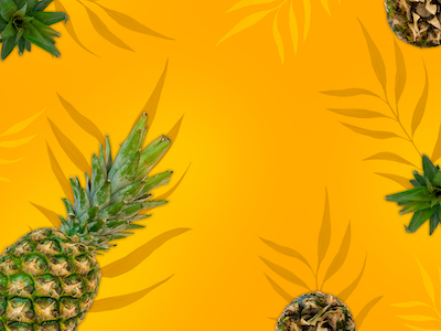 Pineapples on orange background