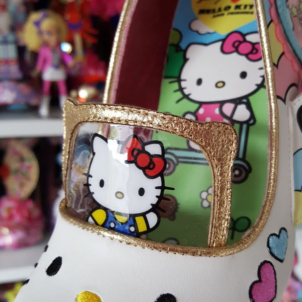 close up of Hello Kitty plastic window detail across front of shoe