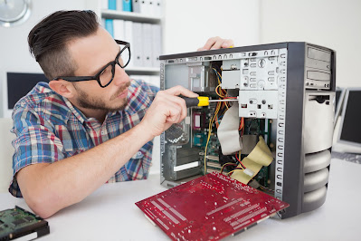 computer guy fixing its hardware cabinet