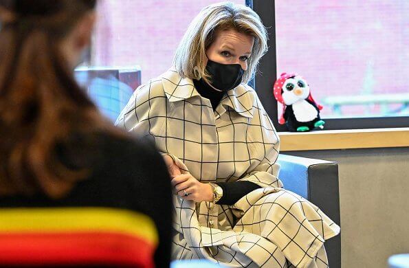 Queen Mathilde wore a new nevil check wool canvas cape and trousers from Natan. The Queen's new outfit is from the fashion house Natan