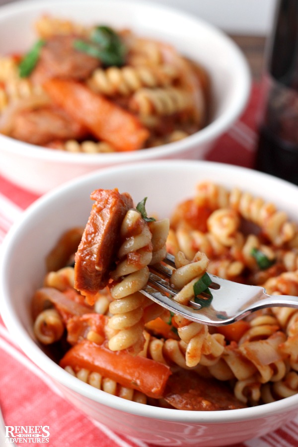Smoked Sausage and Pepper Pasta Skillet on a fork in a white bowl